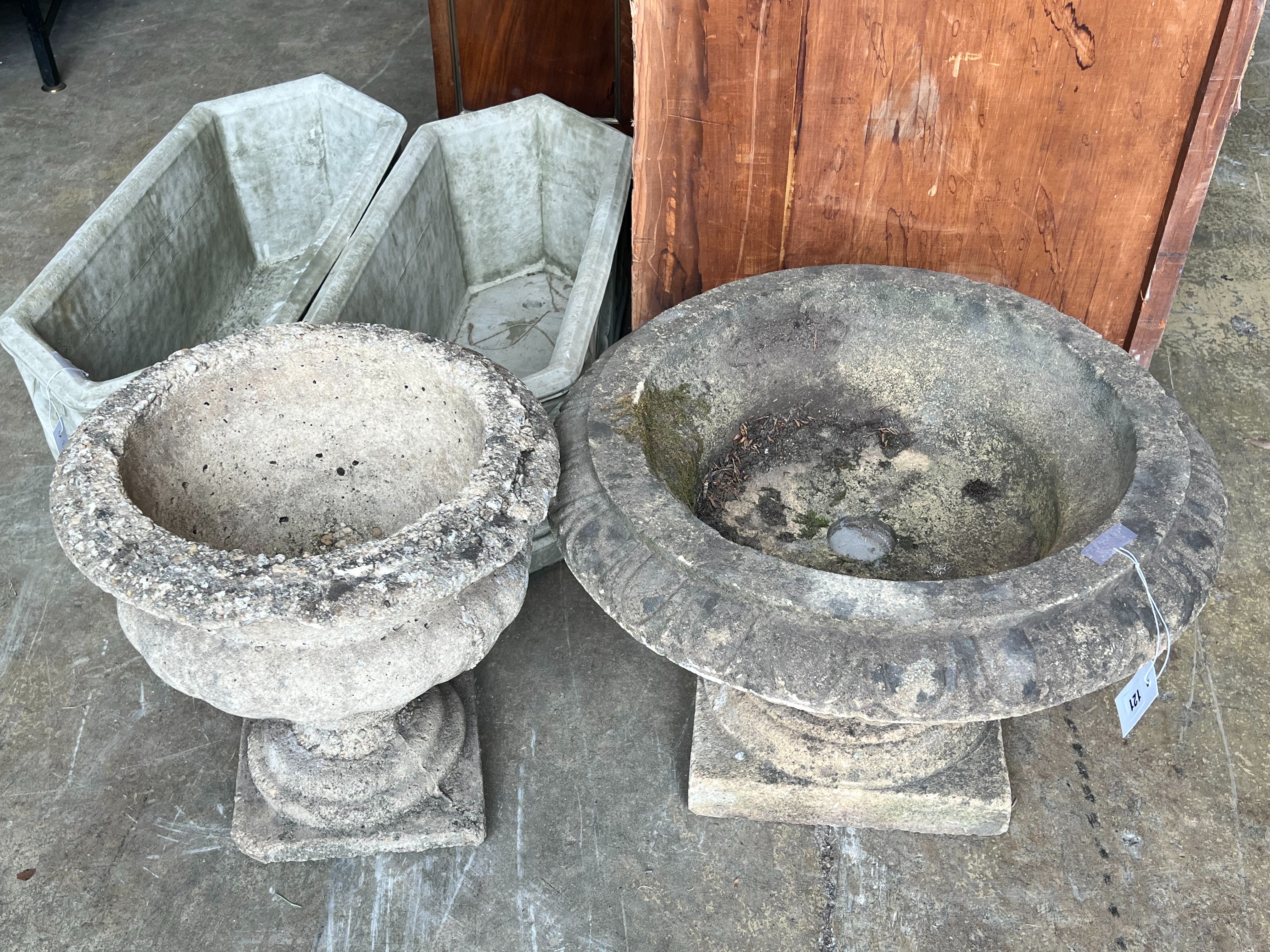 Two reconstituted stone circular campana garden urns, larger diameter 58cm height 38cm